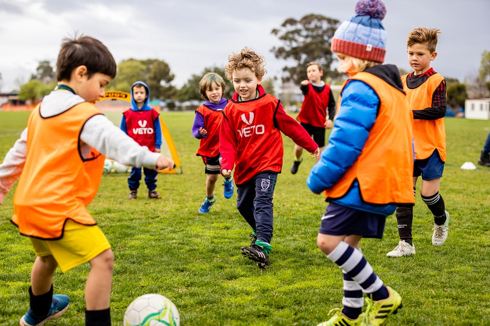 Kids playing a soccer game