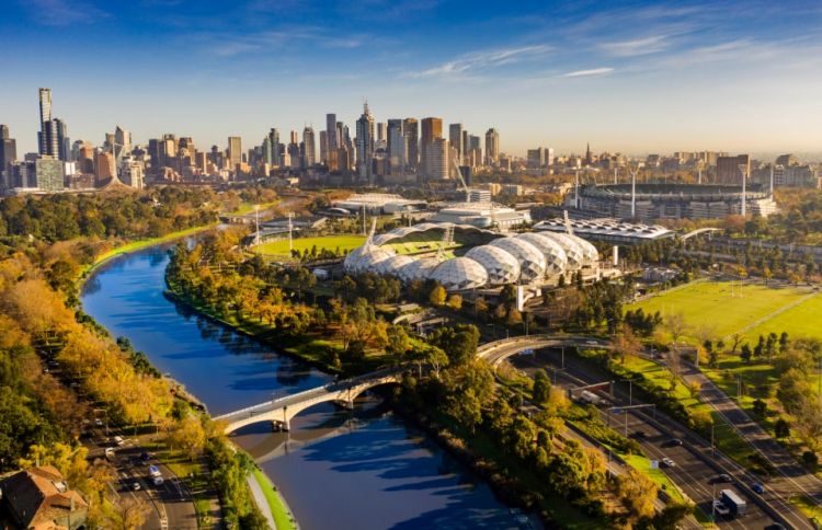 Aerial shot of Melbourne looking back over the sports precinct including AAMI Park and the MCG.