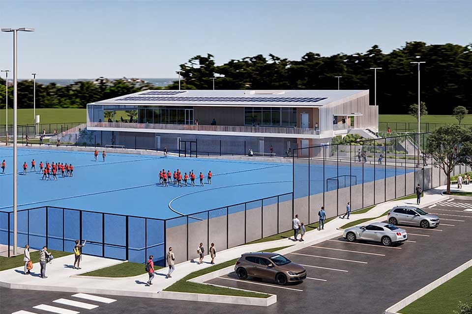 Artist render of Stead Park showing the clubhouse and players on the hockey field.