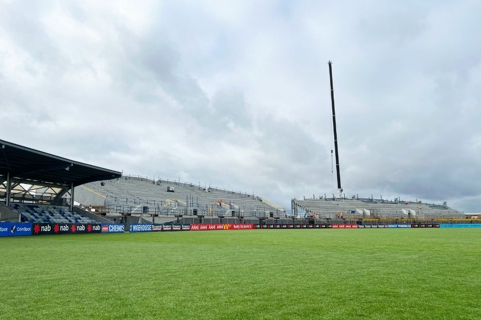 Stands at Ballarat's Mars Stadium under construction with a crane in the background.