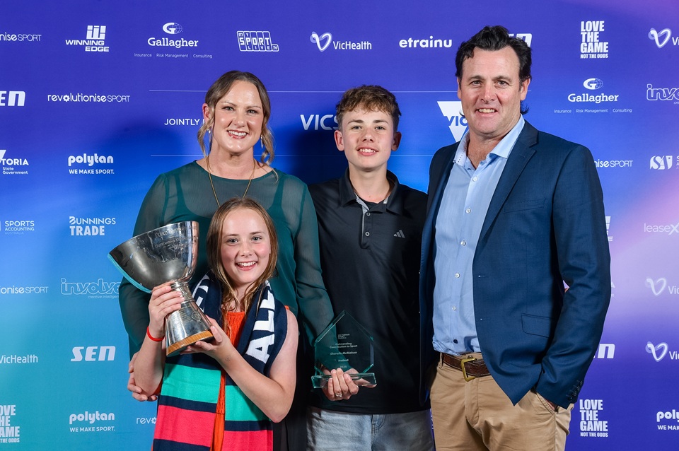 Sharelle McMahon with family receiving a Victorian Sport Award