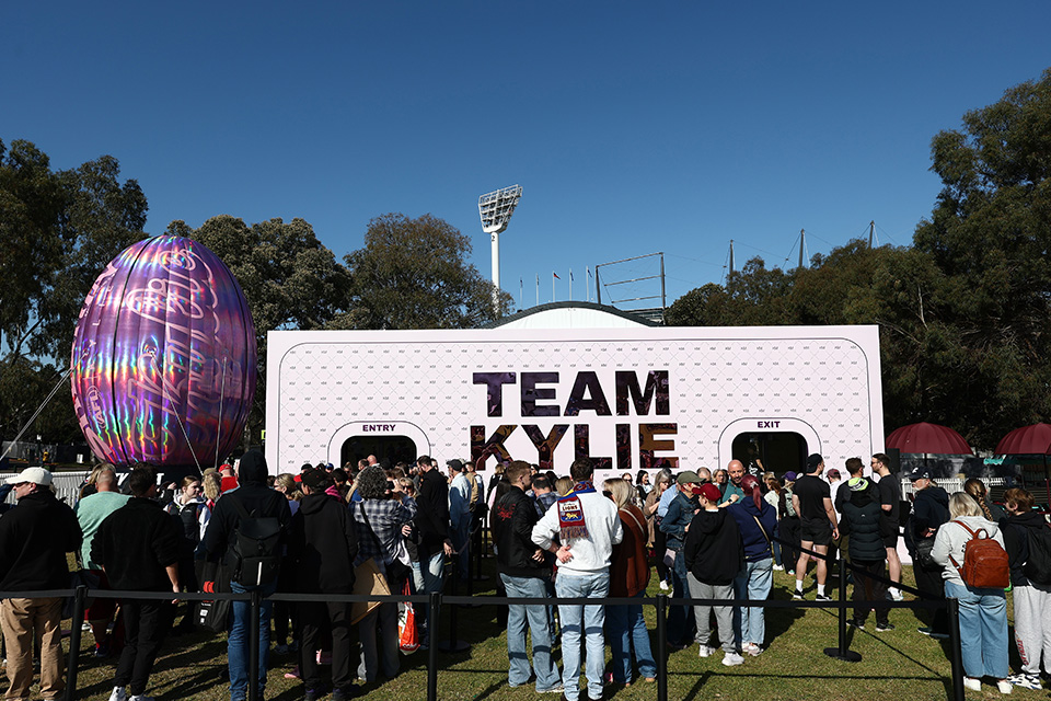 Fans lining up for the Team Kylie activation before the opening of the Footy Festival.