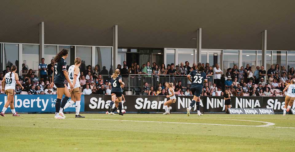 A-League Players contest the ball as Melbourne Victory take on Newcastle Jets at Shepparton's John McEwen Reserve.