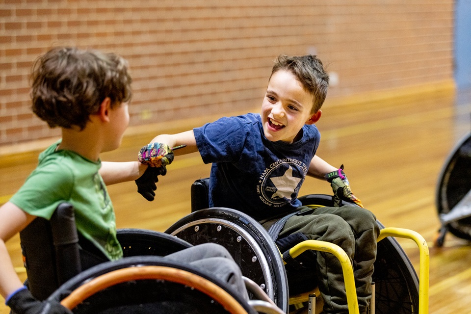 Kids playing wheelchair rugby