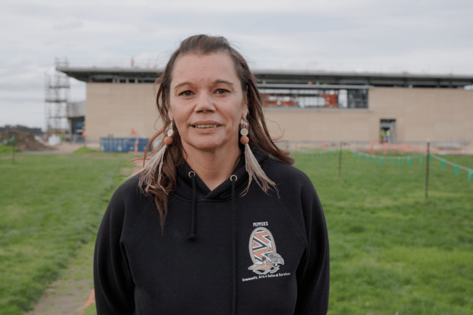 Alice Pepper standing in front construction building