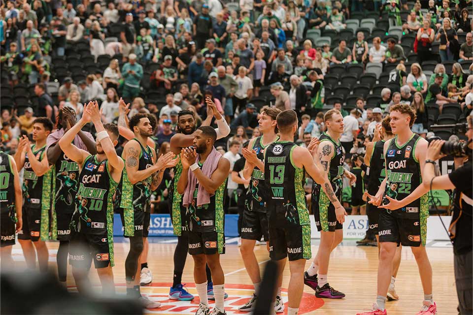 SE Melbourne Phoenix players clap the crows at the end of the game.