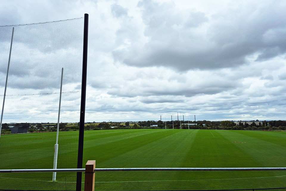The MCG-sized oval at the Kennedy Centre, with netting behind the goal posts. 