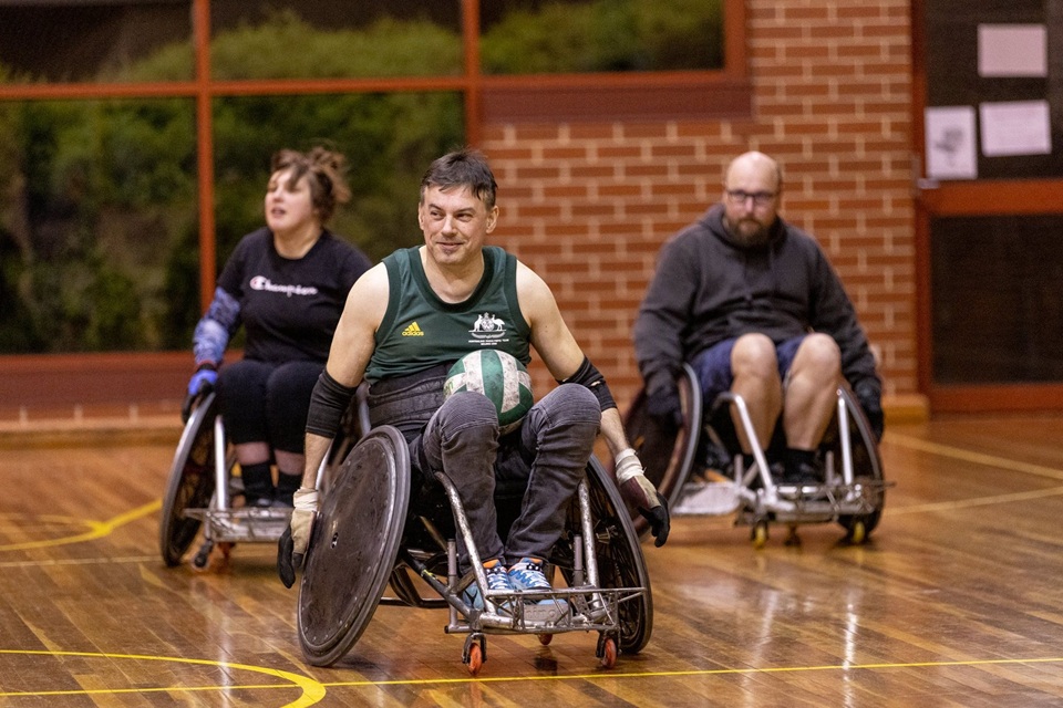 Wheelchair rugby players on court 
