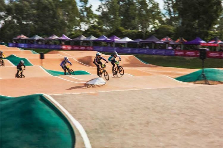Riders race around the track at Shepparton BMX Club.
