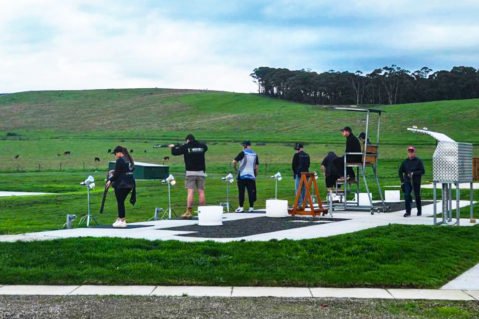 Athletes practicing shooting at gun club