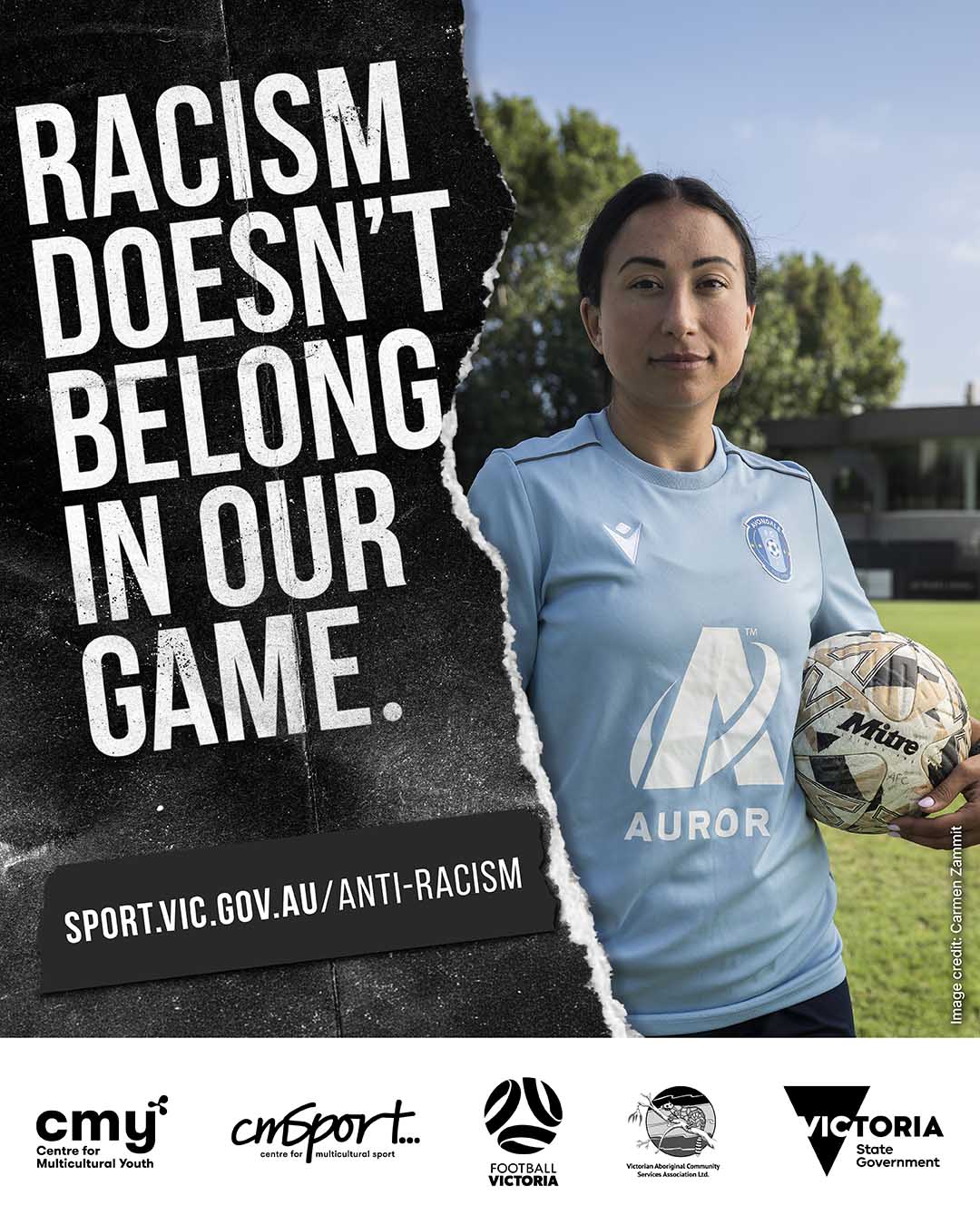 person holding soccor with text 'Racism doesn't belong in our game' with link to 'sport.vic.gov.au/anti-racism