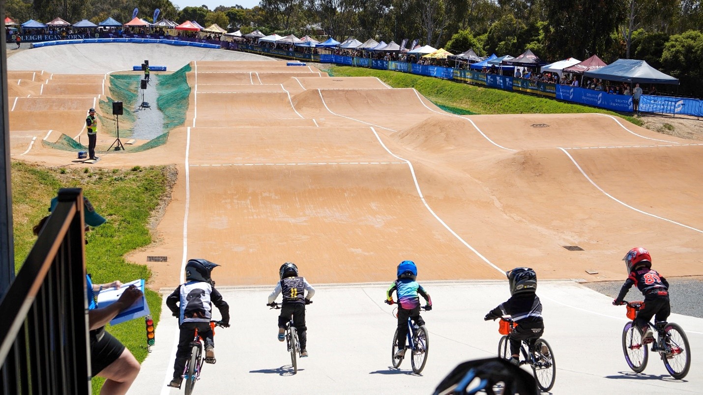 Five junior BMX riders race at the Shepparton BMX club